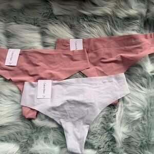 THREE (3) Calvin Klein Women's Invisibles Thong Panty Medium NEW with TAGS